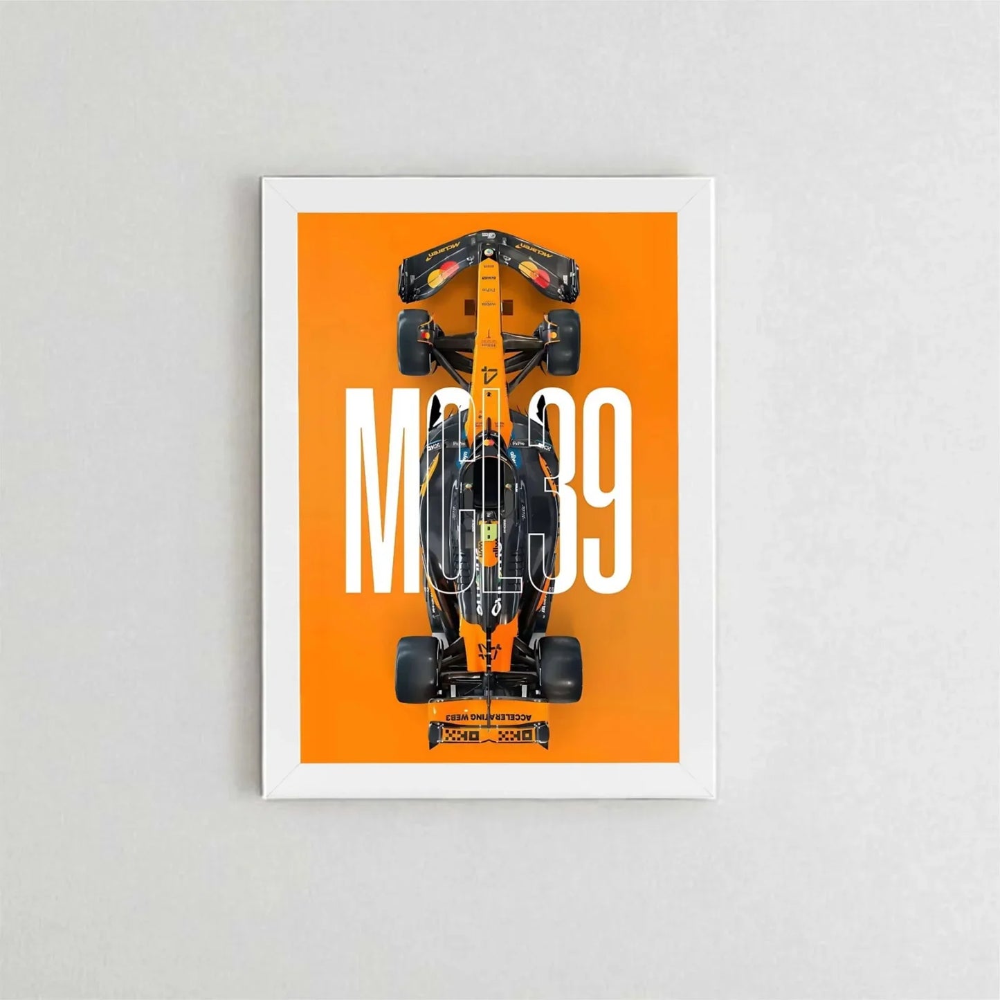Framed poster of a Formula 1 car with 'MCL39' on an orange background