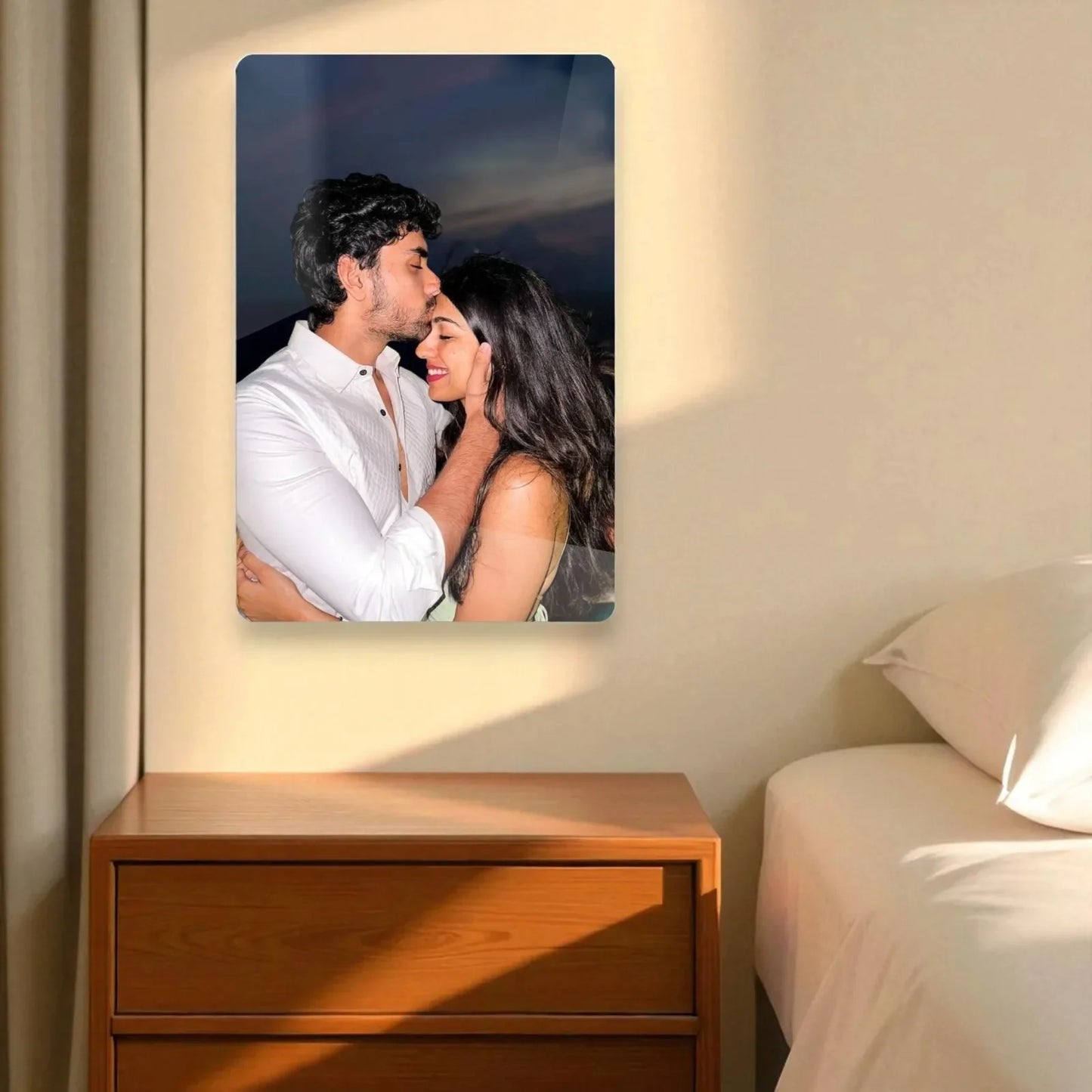 Customized acrylic wall photo frame mounted in a bedroom with sunlight on the wall