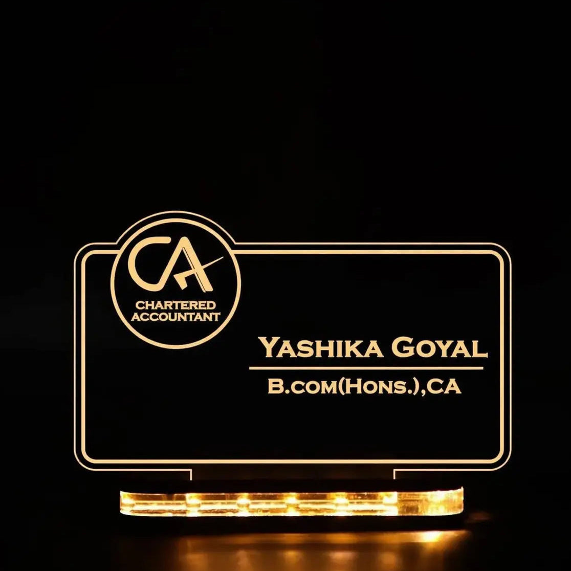Lighted nameplate with 'Chartered Accountant' logo and text on a black background