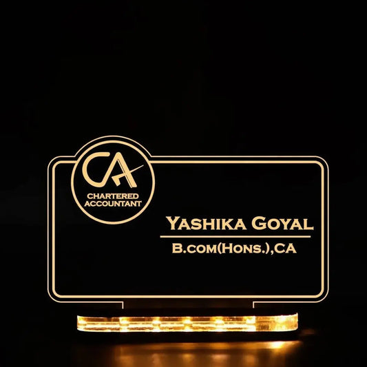 Lighted nameplate with 'Chartered Accountant' logo and text on a black background