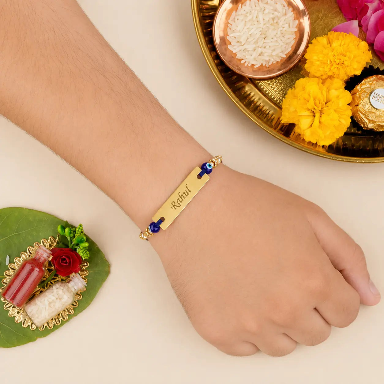 Custom Engraved Gold Name Rakhi with Blue Thread and Evil Eye