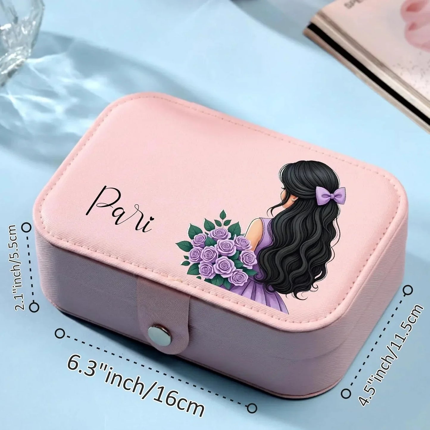 
Pink jewellery case interior with ring slots, earring holder and necklace compartments