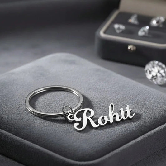 Personalized Silver Name Keychain on Grey Box