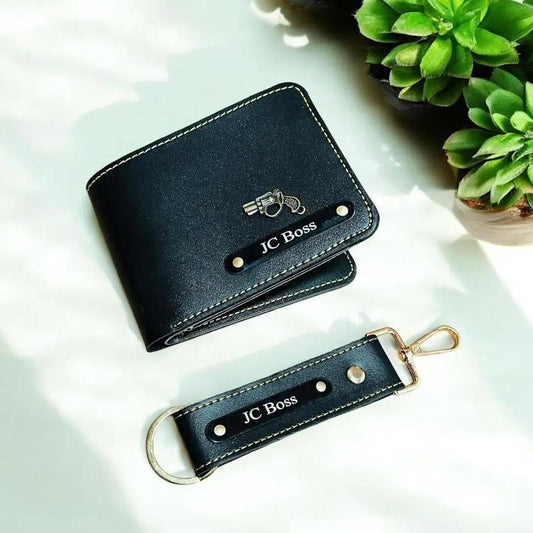 black wallet and keychain with charm 
