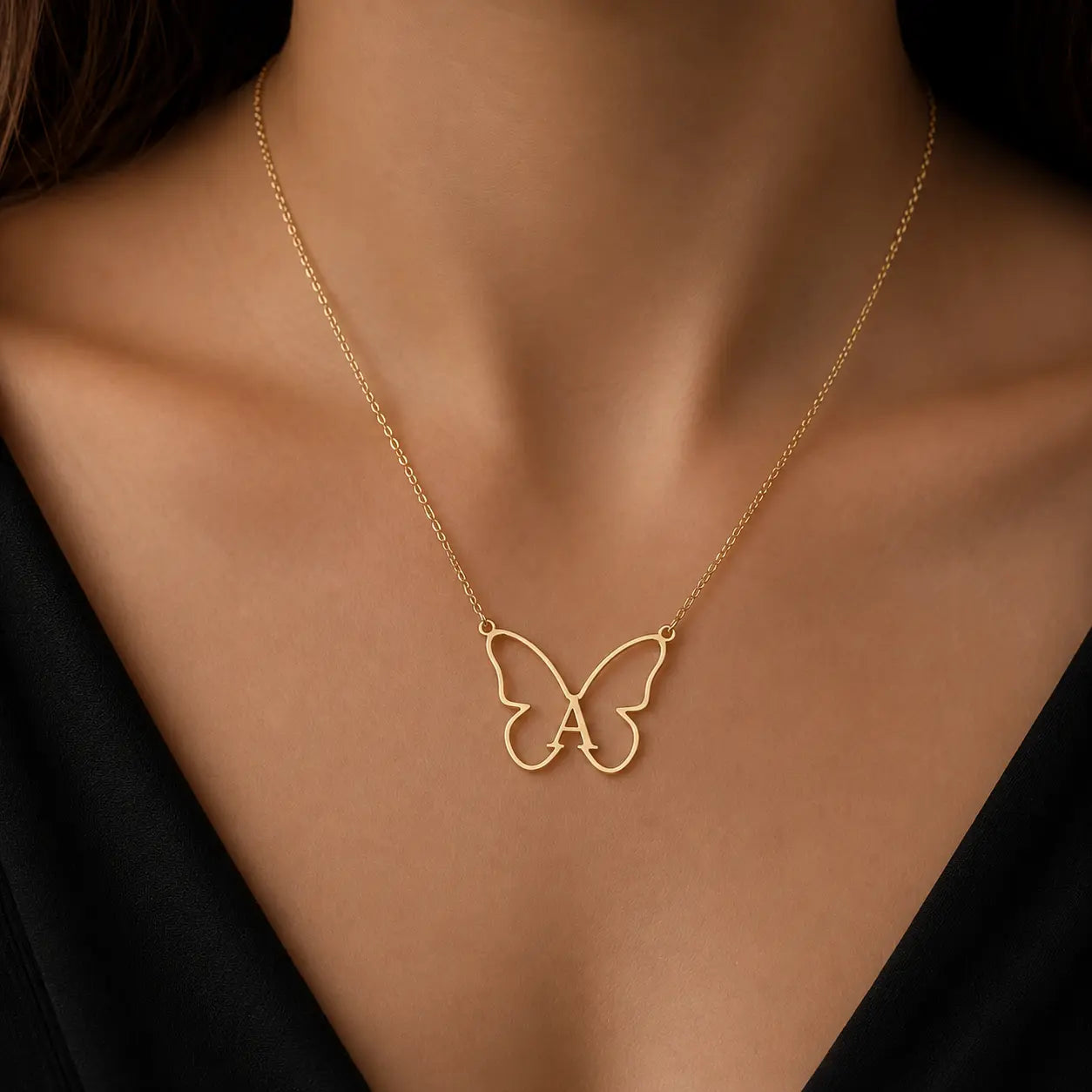 Elegant gold butterfly pendant necklace with personalized initial design